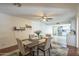 Cozy dining area with contemporary table and chairs adjacent to the kitchen at 6251 E Hannibal St, Mesa, AZ 85205