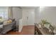 Inviting foyer with hardwood floors, dark wood furniture, and a cozy couch at 6251 E Hannibal St, Mesa, AZ 85205