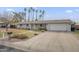 Charming single story home with mature trees and well-manicured front yard at 6251 E Hannibal St, Mesa, AZ 85205