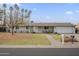 Charming single story home with mature trees and well-manicured front yard at 6251 E Hannibal St, Mesa, AZ 85205