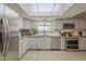 Kitchen featuring modern stainless steel appliances, a window view, and granite countertops at 6251 E Hannibal St, Mesa, AZ 85205