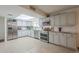Spacious kitchen with stainless steel appliances, bright lighting, and lots of counter space at 6251 E Hannibal St, Mesa, AZ 85205
