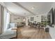 Spacious living room with neutral tones, multiple seating options, and wood floors at 6251 E Hannibal St, Mesa, AZ 85205