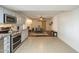 Open concept living space with updated kitchen, dining area, and stylish barn door detail at 6251 E Hannibal St, Mesa, AZ 85205