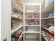 Spacious pantry with ample shelving for organized storage at 6251 E Hannibal St, Mesa, AZ 85205