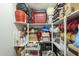 A closet with multiple shelves packed with personal items and storage bins at 6251 E Hannibal St, Mesa, AZ 85205