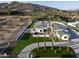 Stunning aerial view showcasing an immaculate home with pristine landscaping and a spacious driveway at 6500 E Cactus Wren Rd, Paradise Valley, AZ 85253