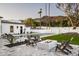Backyard featuring a pool, a modern fire pit with lounge chairs, and mountain views at 6500 E Cactus Wren Rd, Paradise Valley, AZ 85253