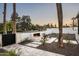 Relaxing outdoor space features tiled patio, built-in fireplace, desert landscaping, and view of Mummy Mountain at 6500 E Cactus Wren Rd, Paradise Valley, AZ 85253