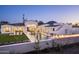 Resort-style backyard showcases pristine pool, built-in firepit, lush landscaping, and views of Mummy Mountain at 6500 E Cactus Wren Rd, Paradise Valley, AZ 85253