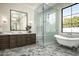 Modern bathroom featuring a glass enclosed shower, soaking tub, and marble countertops at 6500 E Cactus Wren Rd, Paradise Valley, AZ 85253