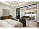 Bedroom featuring a large sliding door opening to the backyard, and views of mountains, and an outdoor seating area at 6500 E Cactus Wren Rd, Paradise Valley, AZ 85253