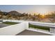 Scenic exterior view from a patio of a home set against a beautiful mountain backdrop at sunset at 6500 E Cactus Wren Rd, Paradise Valley, AZ 85253