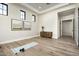 Bright flex space featuring hardwood floors and views of the front yard at 6500 E Cactus Wren Rd, Paradise Valley, AZ 85253