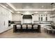 Elegant kitchen features custom cabinets, marble backsplash, large island with seating, and modern stainless appliances at 6500 E Cactus Wren Rd, Paradise Valley, AZ 85253