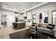 Open living room with modern furnishings, an island kitchen, and lots of natural light at 6500 E Cactus Wren Rd, Paradise Valley, AZ 85253