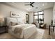 Serene main bedroom with a plush bed, accent chairs, and floor to ceiling windows at 6500 E Cactus Wren Rd, Paradise Valley, AZ 85253