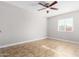 Bedroom with tile floors and natural light at 6817 W Palm Ln, Phoenix, AZ 85035