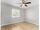 Bedroom with tile floors and a ceiling fan at 6817 W Palm Ln, Phoenix, AZ 85035