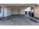 Attached carport with easy access to the house provides covered parking and additional storage at 6817 W Palm Ln, Phoenix, AZ 85035