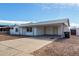 Spacious carport attached to the house offers covered parking and storage space at 6817 W Palm Ln, Phoenix, AZ 85035