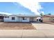 Charming single-story home featuring a covered carport and low-maintenance front yard at 6817 W Palm Ln, Phoenix, AZ 85035