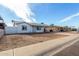 Lovely single-story home with an extended carport and desert-style landscaping at 6817 W Palm Ln, Phoenix, AZ 85035