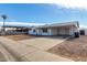 Inviting single-level house with a covered carport and easy-to-care-for yard at 6817 W Palm Ln, Phoenix, AZ 85035