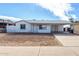 Charming single-story home featuring a covered carport and low-maintenance front yard at 6817 W Palm Ln, Phoenix, AZ 85035
