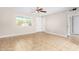 Bright living room showcases tile flooring, a ceiling fan, and ample natural light at 6817 W Palm Ln, Phoenix, AZ 85035