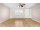 Open living room featuring tile flooring, ceiling fan, and natural light from large window at 6817 W Palm Ln, Phoenix, AZ 85035