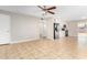 Bright living room features tile floors and a ceiling fan at 6817 W Palm Ln, Phoenix, AZ 85035
