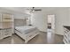 Bright bedroom with light-colored furniture and an ensuite bathroom at 7102 W Julie Dr, Glendale, AZ 85308
