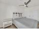 Cozy bedroom with white furniture, neutral decor, and ample closet space at 7102 W Julie Dr, Glendale, AZ 85308