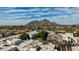 Expansive aerial view showcases the neighborhood near the majestic mountain, under a blue sky with some clouds at 7121 E Mcdonald Dr, Paradise Valley, AZ 85253