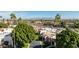 A high angle shot of a residential neighborhood with greenery, palm trees and mountain views at 7121 E Mcdonald Dr, Paradise Valley, AZ 85253