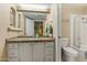 Functional bathroom with a single sink vanity, a framed mirror, and a shower-tub combination at 7121 E Mcdonald Dr, Paradise Valley, AZ 85253