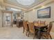 Elegant dining room featuring a wooden table with seating for six and mirrored wall accents at 7121 E Mcdonald Dr, Paradise Valley, AZ 85253