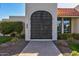 Close up of the ornate arched gate leading to this lovely residence at 7121 E Mcdonald Dr, Paradise Valley, AZ 85253