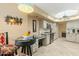 Kitchen with stainless steel appliances, granite countertops, tiled backsplash, and adjacent dining nook with bar seating at 7121 E Mcdonald Dr, Paradise Valley, AZ 85253