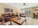 Cozy living room showcasing comfortable leather furniture, neutral walls, and direct access to the patio area at 7121 E Mcdonald Dr, Paradise Valley, AZ 85253