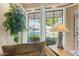 Bright living space with neutral decor, large windows, and plantation shutters at 7121 E Mcdonald Dr, Paradise Valley, AZ 85253