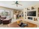 Open-concept layout with a living room that transitions seamlessly into the kitchen and outdoor access at 7121 E Mcdonald Dr, Paradise Valley, AZ 85253