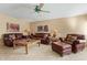 Inviting living room featuring comfortable leather seating, a ceiling fan, and stylish decor for relaxation and entertainment at 7121 E Mcdonald Dr, Paradise Valley, AZ 85253