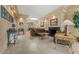 Spacious living room features elegant tile flooring, fireplace and decorative tray ceiling at 7121 E Mcdonald Dr, Paradise Valley, AZ 85253