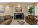 Living room boasts a fireplace, recessed lights, comfortable seating and decorative touches at 7121 E Mcdonald Dr, Paradise Valley, AZ 85253