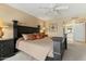 Comfortable main bedroom featuring a spacious layout, neutral walls, and a decorative ceiling fan at 7121 E Mcdonald Dr, Paradise Valley, AZ 85253