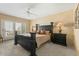 Spacious main bedroom with a decorative ceiling fan, a large window, and carpeted flooring at 7121 E Mcdonald Dr, Paradise Valley, AZ 85253