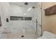 Modern walk-in shower featuring marble-style tiles, glass enclosure, and rainfall showerhead at 7121 E Mcdonald Dr, Paradise Valley, AZ 85253