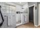 Modern bathroom with white subway tiles, a glass block window, and a walk-in shower at 714 W Desert Hills Dr, San Tan Valley, AZ 85143